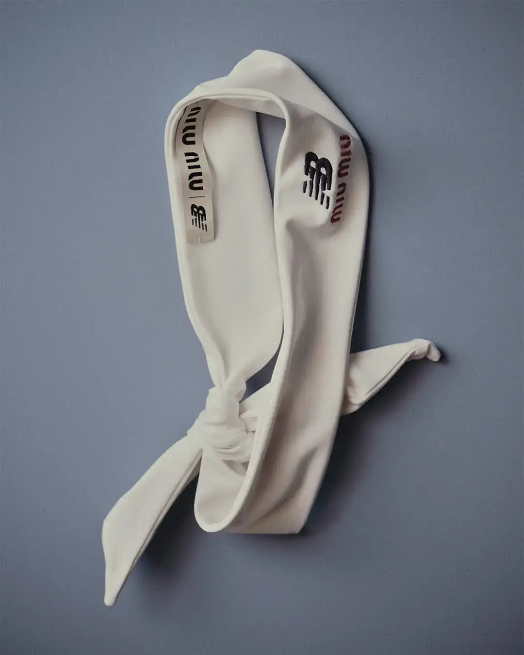NEW BALANCE AND MIU MIU LAUNCH COCO GAUFF LINE image detailing the performance tennis clothing collaboration between New Balance and Miu Miu worn by athlete Coco Gauff. (image 6 of 12)