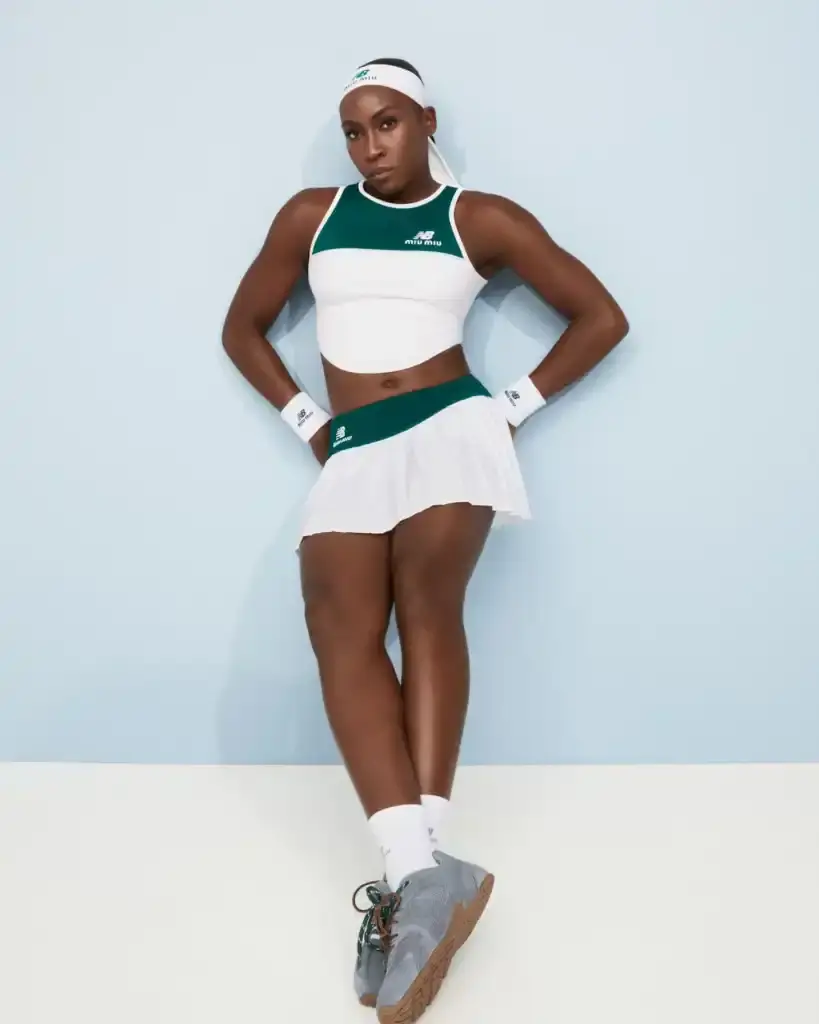 COCO GAUFF TO SPORT NEW BALANCE AND MIU MIU TENNIS COLLECTION image of collaboration between New Balance and Miu Miu featuring tennis champion Coco Gauff. It details how Gauff will wear the collection during tournaments in Rome, Berlin, and Cincinnati, describes the on-court outfits with color-block designs and co-branded Coco CG2 shoes, as well as off-court attire including zip hoodies and 530 SL sneakers. The collection launches September 10th at select stores and online, with Gauff hosting a Miu Miu Select event in New York the same day to showcase her personal picks from the Fall/Winter 2025 collection.