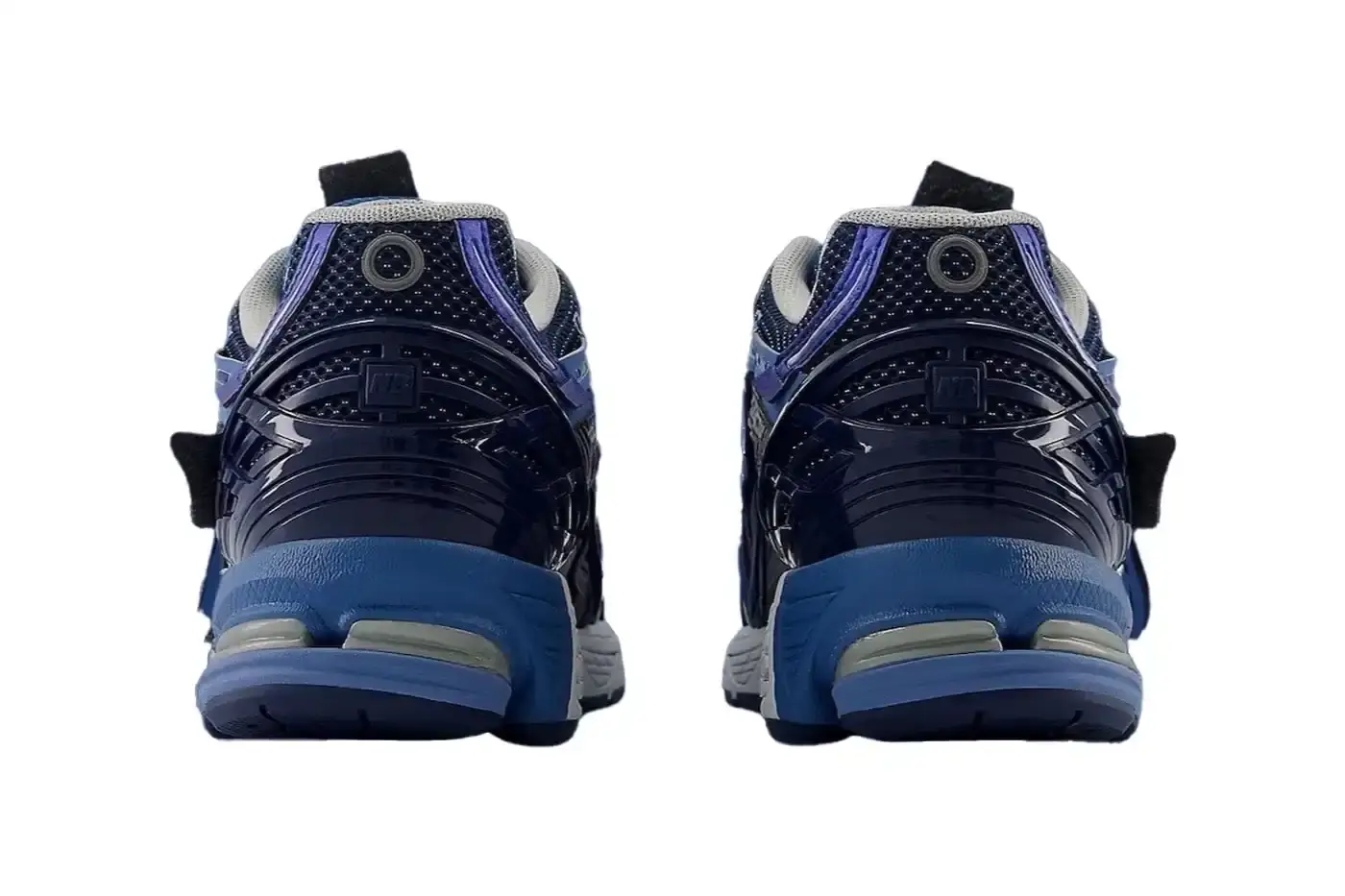 New Balance New Balance 1906A sneaker in Navy and Vintage Indigo colorway. The shoe features a mesh and synthetic upper with blue suede toe cap, ultramarine stripes on the sides, and a Sea Stone-colored midsole. Multiple shades of blue create a layered, technical appearance typical of Y2K-era running shoes. (image 5 of 6)