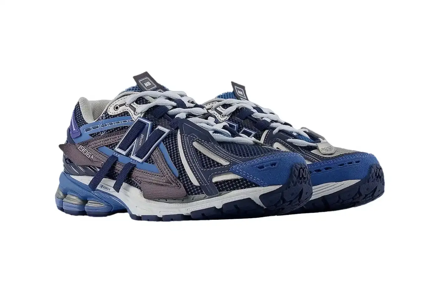 New Balance New Balance 1906A sneaker in Navy and Vintage Indigo colorway. The shoe features a mesh and synthetic upper with blue suede toe cap, ultramarine stripes on the sides, and a Sea Stone-colored midsole. Multiple shades of blue create a layered, technical appearance typical of Y2K-era running shoes. (image 3 of 6)