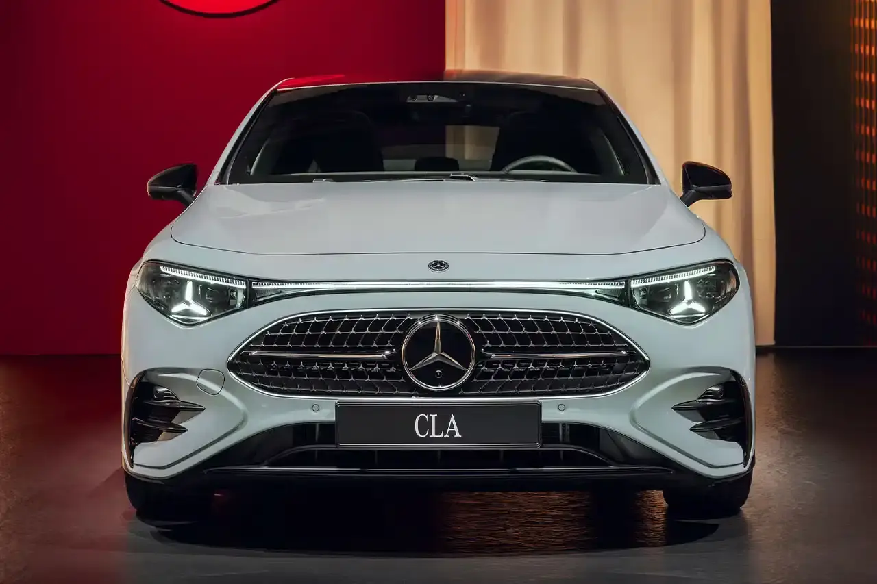Mercedes-Benz The new Mercedes-Benz CLA sedan featuring a sleek design with illuminated grille, panoramic roof, and minimalist interior with MBUX Superscreen. (image 7 of 13)