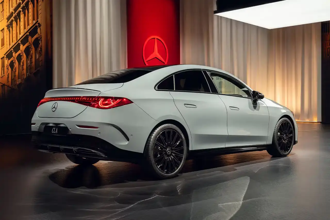 Mercedes-Benz The new Mercedes-Benz CLA sedan featuring a sleek design with illuminated grille, panoramic roof, and minimalist interior with MBUX Superscreen. (image 8 of 13)