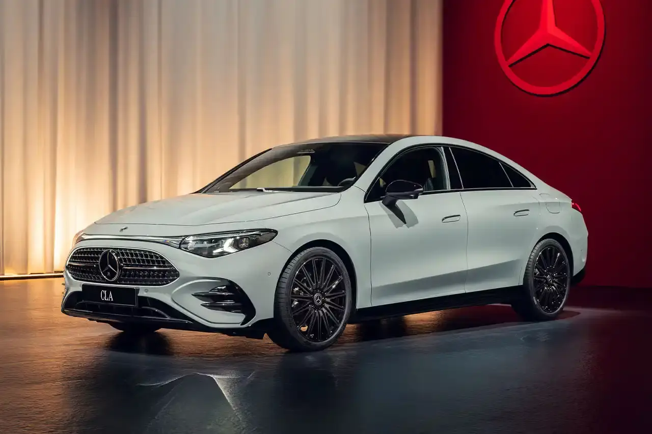 Mercedes-Benz The new Mercedes-Benz CLA sedan featuring a sleek design with illuminated grille, panoramic roof, and minimalist interior with MBUX Superscreen. (image 9 of 13)