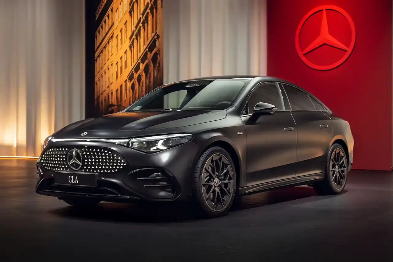 Mercedes-Benz The new Mercedes-Benz CLA sedan featuring a sleek design with illuminated grille, panoramic roof, and minimalist interior with MBUX Superscreen. (image 10 of 13)