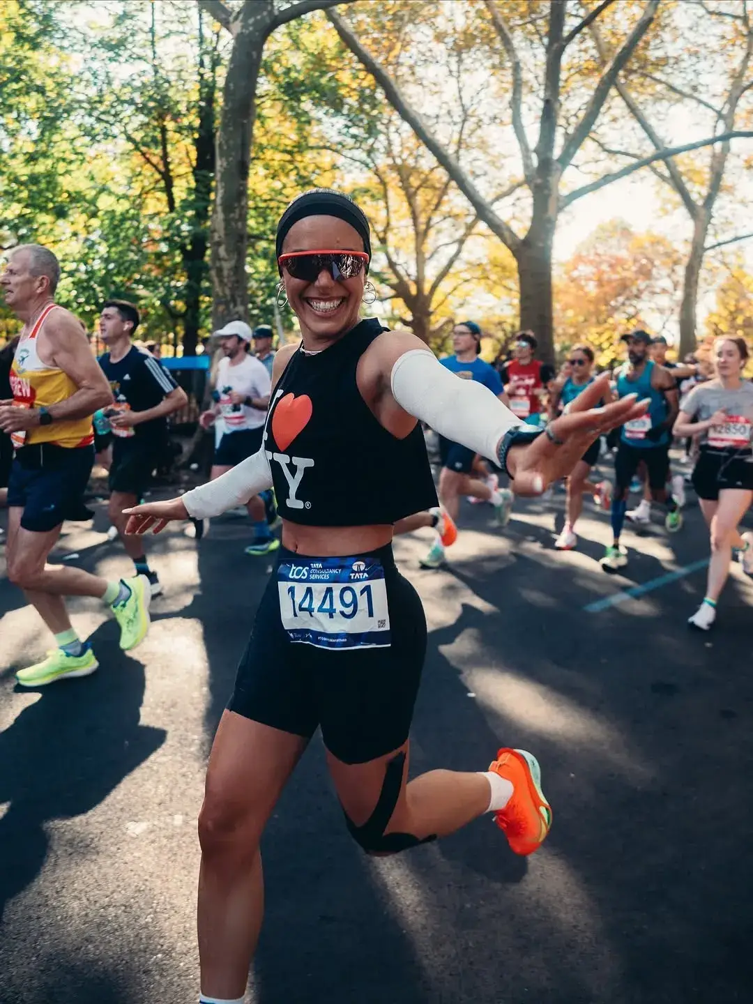 Runners cross the Verrazzano-Narrows Bridge into Brooklyn during the five-borough New York City Marathon on autumn streets.