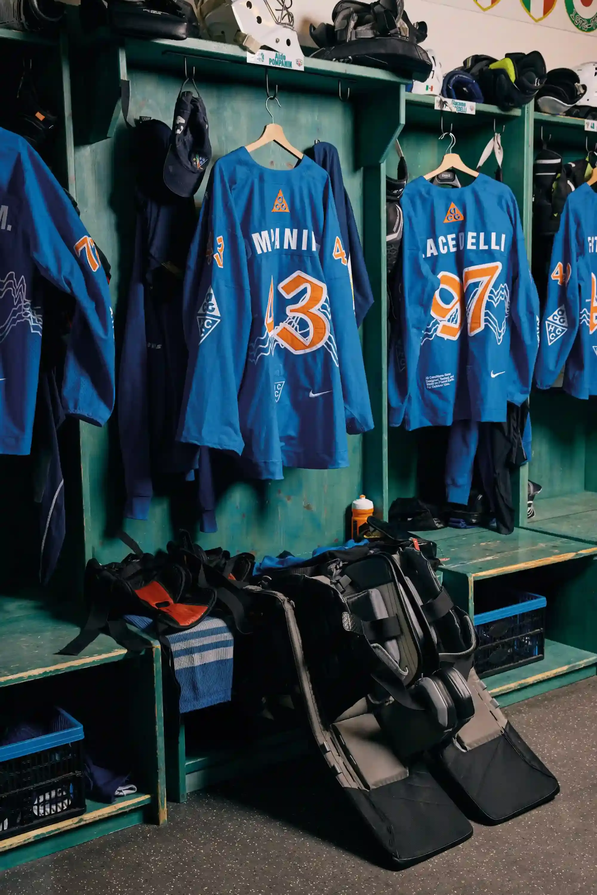 NIKE ACG AND SG CORTINA DEBUT MOUNTAIN-INSPIRED HOCKEY JERSEY image describes collaboration between Nike ACG and SG Cortina hockey team on special edition jersey. Design features Dolomite mountain silhouettes. Jersey worn once during December 7 match at Olympic Ice Stadium in Cortina d'Ampezzo. Limited quantities available at Acqua Salata store starting December 8. (image 5 of 5)