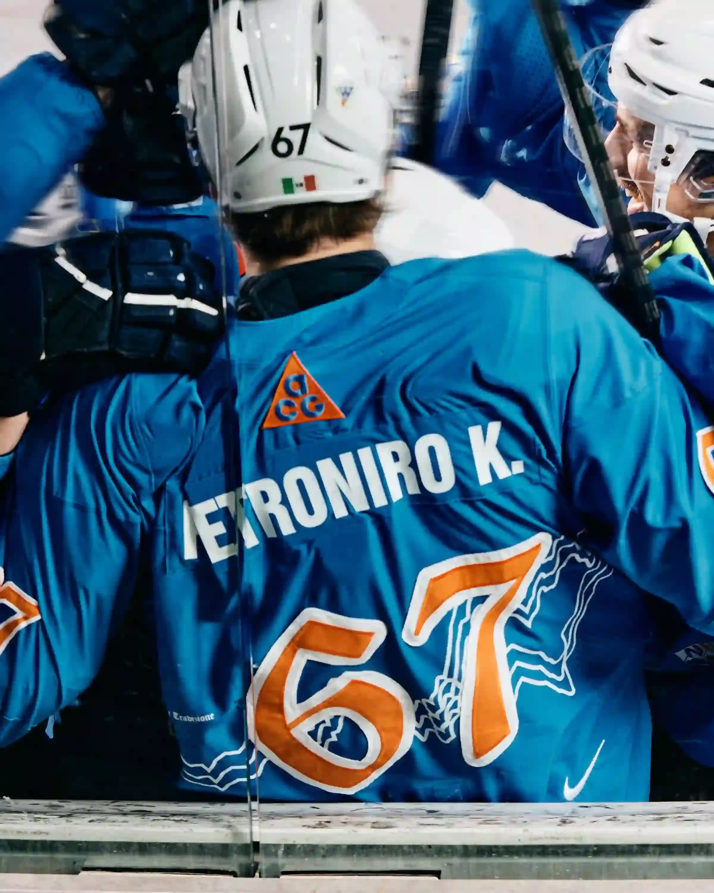 NIKE ACG AND SG CORTINA DEBUT MOUNTAIN-INSPIRED HOCKEY JERSEY image describes collaboration between Nike ACG and SG Cortina hockey team on special edition jersey. Design features Dolomite mountain silhouettes. Jersey worn once during December 7 match at Olympic Ice Stadium in Cortina d'Ampezzo. Limited quantities available at Acqua Salata store starting December 8. (image 4 of 5)