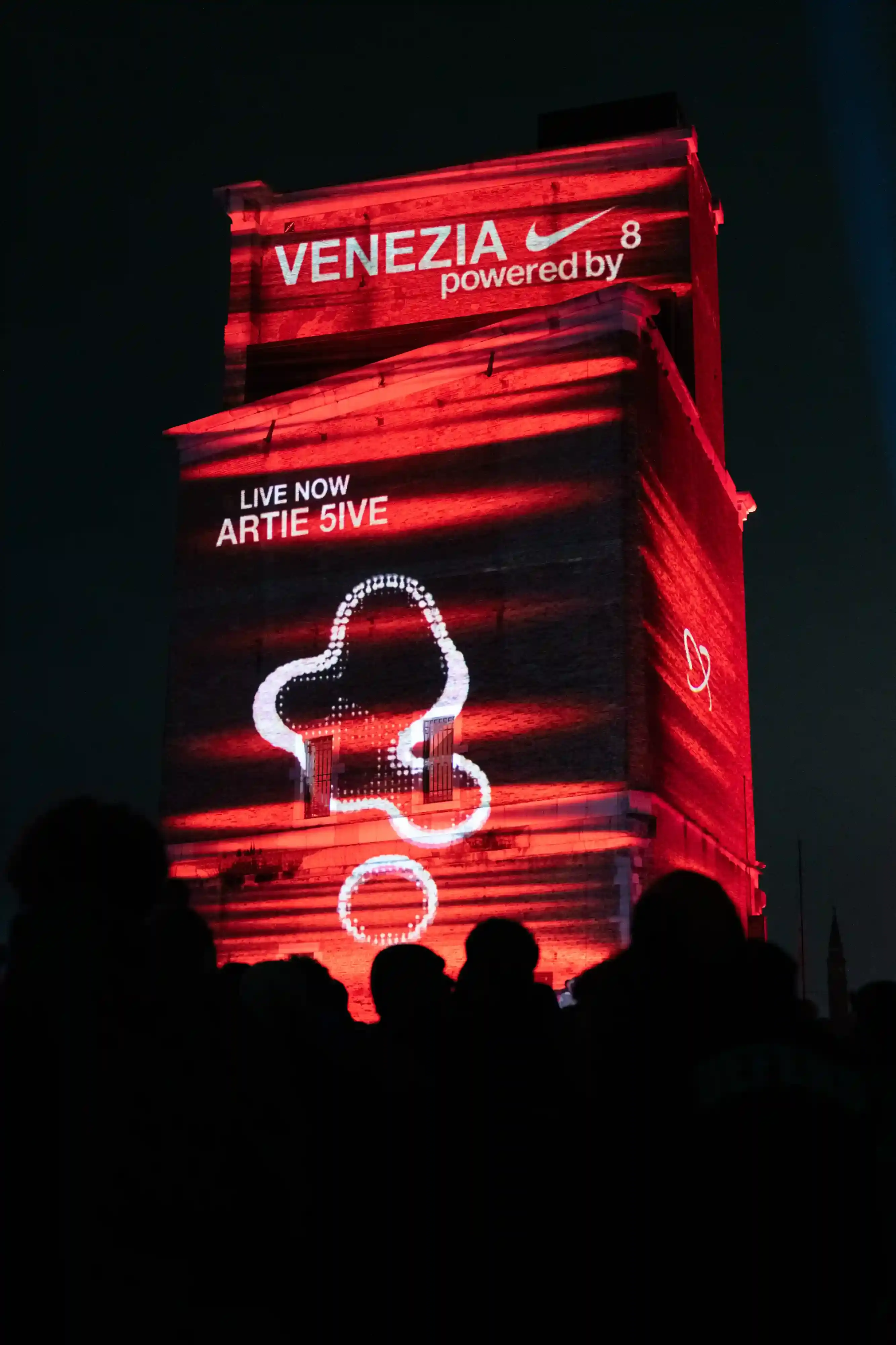 NIKE AIR MAX DN8 TAKES OVER VENICE'S ARSENALE Photo covers Nike's Air Max Dn8 launch event at Venice's Arsenale Tesa 105. It describes the venue transformation, sports demonstrations by 24.7fastlife and Speed Boat collectives, musical performances by rappers Promessa and Artie 5ive, and DJ sets by Metabolismo Lagunare. The article includes details about the shoe's eight air pods designed for various high-energy activities and Nike's positioning of the product for athletic consumers. (image 8 of 11)