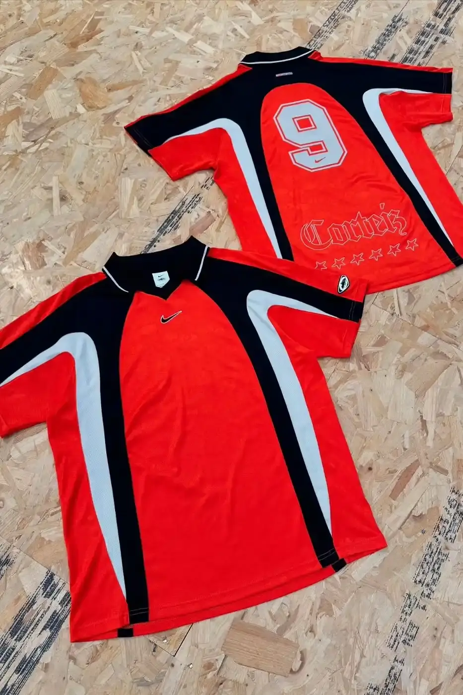 Nike x Corteiz apparel collection featuring football-inspired windbreakers, trousers, and polo shirts with co-branded designs in athletic streetwear style. (image 5 of 5)