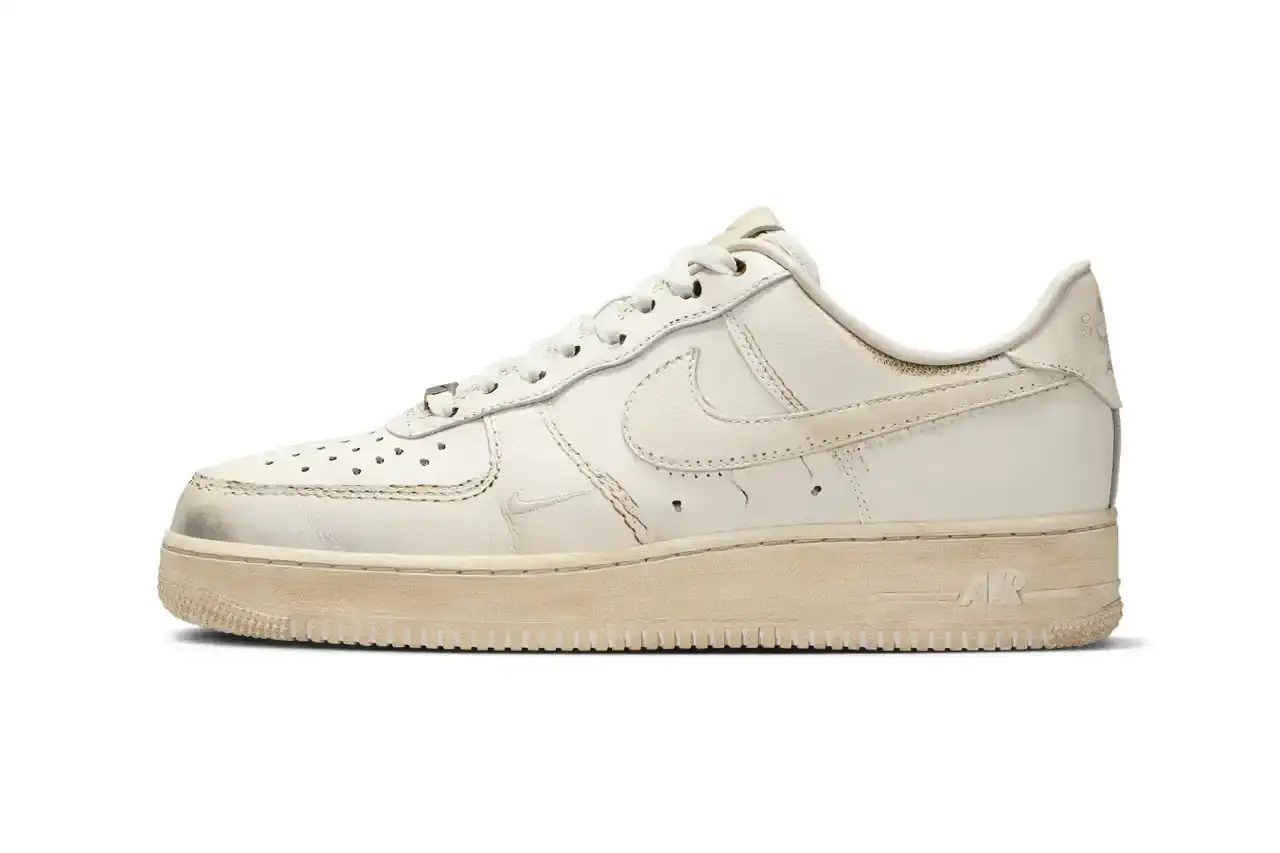 NIKE'S UNIQUE TWIST: "DIRTY" AIR FORCE 1 LOW SNEAKERS REVEALED image of details Nike's upcoming "Dirty Triple White" Air Force 1 Low sneakers, which feature an innovative design that appears worn when new but becomes cleaner with use. The article covers the release through Nike's .SWOOSH platform, mentions the included toothbrush for cleaning, and notes the May 7 US-only release date via the SNKRS app. The piece provides context about Nike's previous digital-physical crossover releases and explains the concept behind this unconventional approach to the classic silhouette. (image 1 of 8)