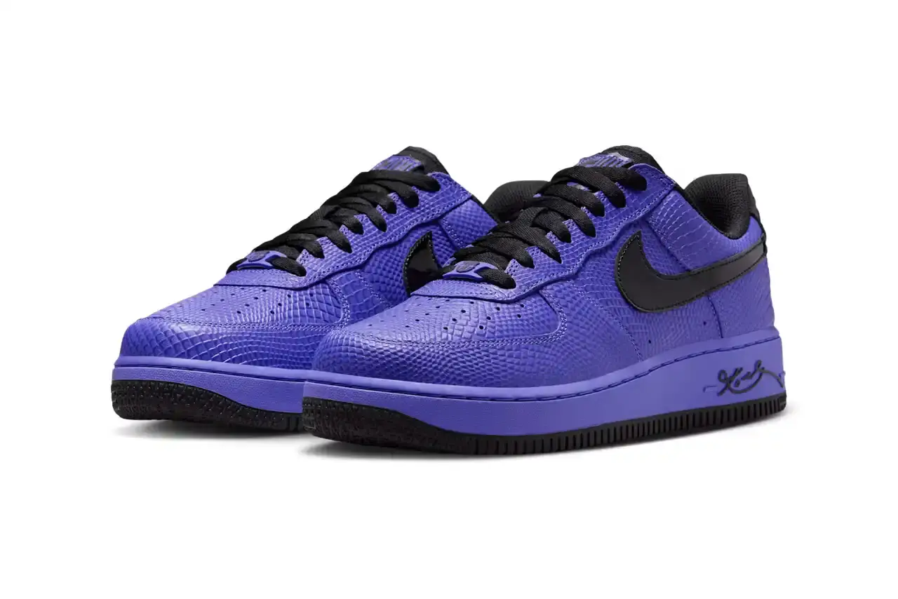NIKE REVEALS FC BARCELONA KOBE BRYANT AIR FORCE 1 image about Nike's upcoming sneaker release featuring FC Barcelona and Kobe Bryant branding on an Air Force 1 Low silhouette. The shoe has a purple textured upper with black accents and Barcelona club crests. Includes product details, pricing at $150, and expected 2025 release through Nike's retail channels. Content is structured with bullet point summary, product specifications, and background information about the collaboration. (image 3 of 10)