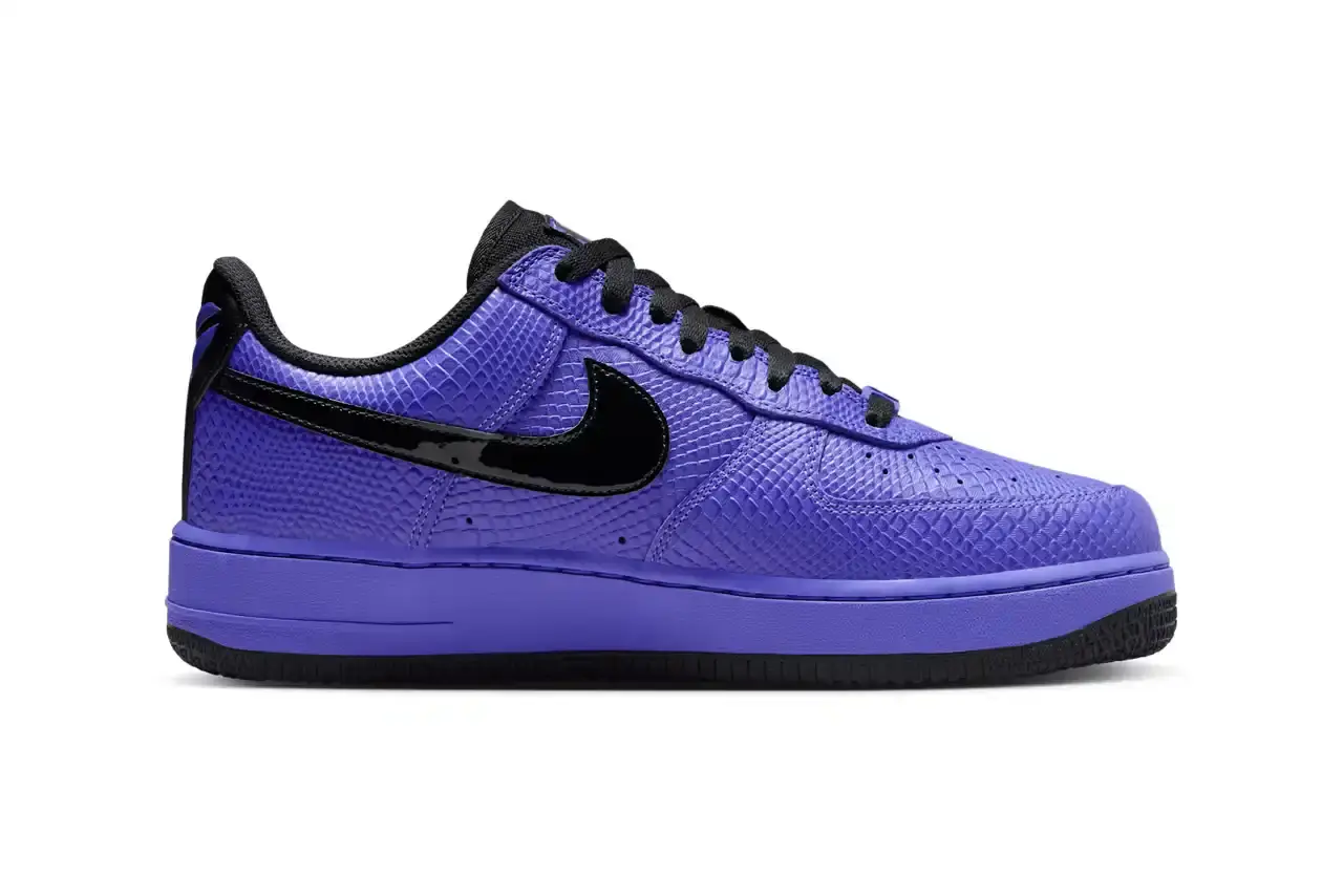 NIKE REVEALS FC BARCELONA KOBE BRYANT AIR FORCE 1 image about Nike's upcoming sneaker release featuring FC Barcelona and Kobe Bryant branding on an Air Force 1 Low silhouette. The shoe has a purple textured upper with black accents and Barcelona club crests. Includes product details, pricing at $150, and expected 2025 release through Nike's retail channels. Content is structured with bullet point summary, product specifications, and background information about the collaboration. (image 2 of 10)