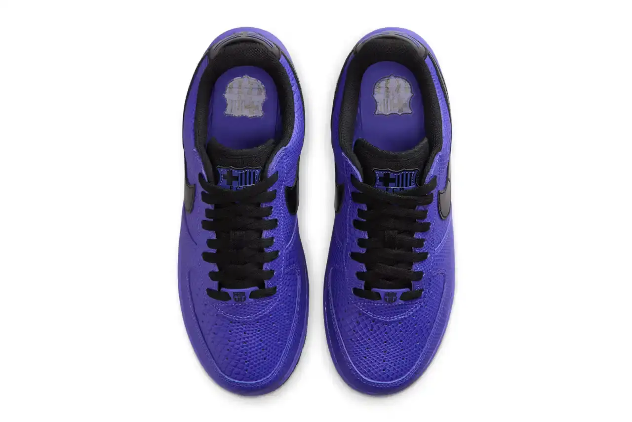 NIKE REVEALS FC BARCELONA KOBE BRYANT AIR FORCE 1 image about Nike's upcoming sneaker release featuring FC Barcelona and Kobe Bryant branding on an Air Force 1 Low silhouette. The shoe has a purple textured upper with black accents and Barcelona club crests. Includes product details, pricing at $150, and expected 2025 release through Nike's retail channels. Content is structured with bullet point summary, product specifications, and background information about the collaboration. (image 4 of 10)
