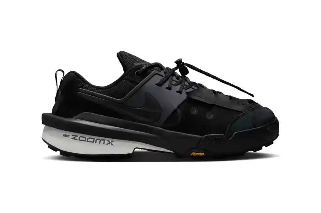 NIKE AND SACAI JOIN FORCES: THE ZEGAMADOME ARRIVES image of the upcoming release of the Nike Zegamadome sneakers, a collaboration with Japanese brand sacai. The article describes the shoe's design features, including its deconstructed aesthetic, materials (suede, leather, textile), and performance elements (Vibram outsole, ZoomX cushioning). It explains how the design incorporates elements from Nike's 1989 Lava Dome hiking boot and maintains signature sacai collaboration features like the double Swoosh logo and extended heel counter. The article details the three available colorways and confirms the May 9th release date through the SNKRS app and select retailers.