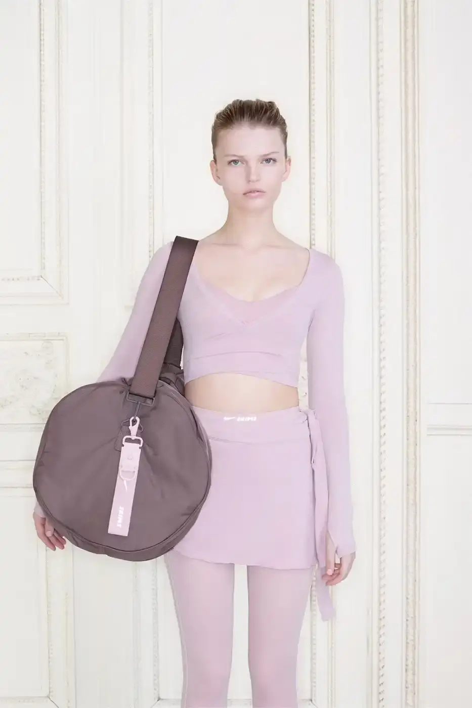 NIKE AND SKIMS DROP BALLET-INSPIRED COLLECTION Nike and SKIMS announce their Spring 2026 collection with ballet-inspired athletic wear, introducing the NikeSKIMS Rift Satin shoe and five material collections. LISA of BLACKPINK appears in the campaign shot in Paris. (image 3 of 13)