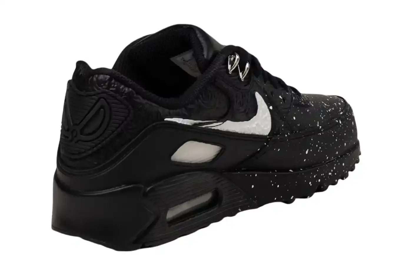 NIKE PARTNERS WITH NIGERIAN ARTIST SLAWN FOR UNIQUE AIR MAX 90 A collaborative design project between Nike and Nigerian artist Slawn, showcasing the creation of two exclusive Air Max 90 sneakers. The piece highlights Slawn's artistic background, his journey from skateboarding to graphic design, and his emergence in the contemporary art scene. The article provides context about the sneakers' design elements, including paint-inspired patterns, leather mudguard, and metallic accents, with information about the release date on the SNKRS app. (image 2 of 4)