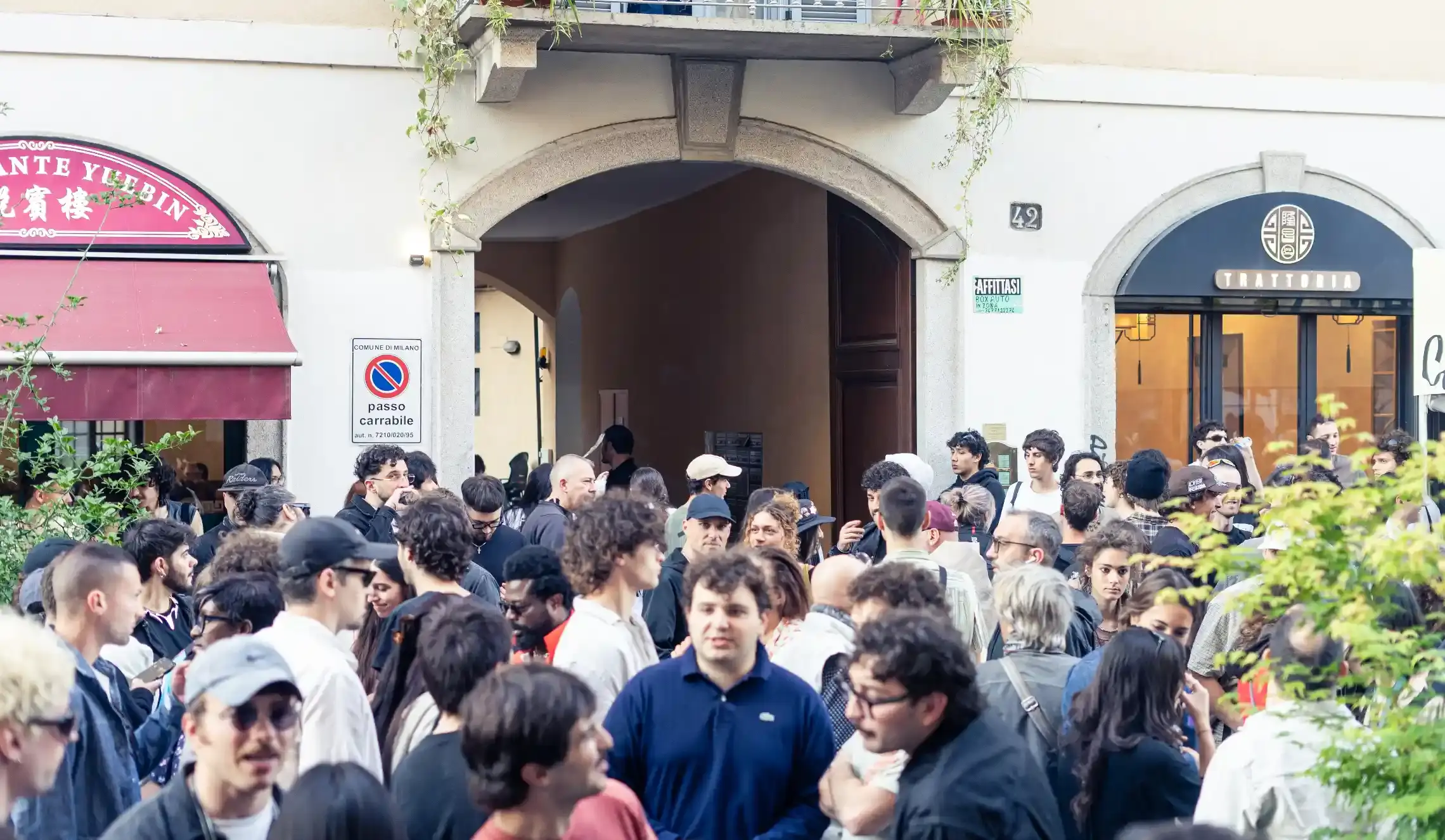 NO BALL GAMES: MILAN'S GRASSROOTS ART MOVEMENT TAKES SHAPE image of the No Ball Games art movement in Milan, founded by photographer Enrico Rassu in 2024. It describes the movement's horizontal hierarchy, philosophy of unrestricted expression, and signature event "70 Chiodi" which allowed hundreds of artists to display work without curation. The piece includes background on Rassu's career as a photographer for musicians and brands, and details how the movement aims to break down barriers in the traditional art world. (image 11 of 13)