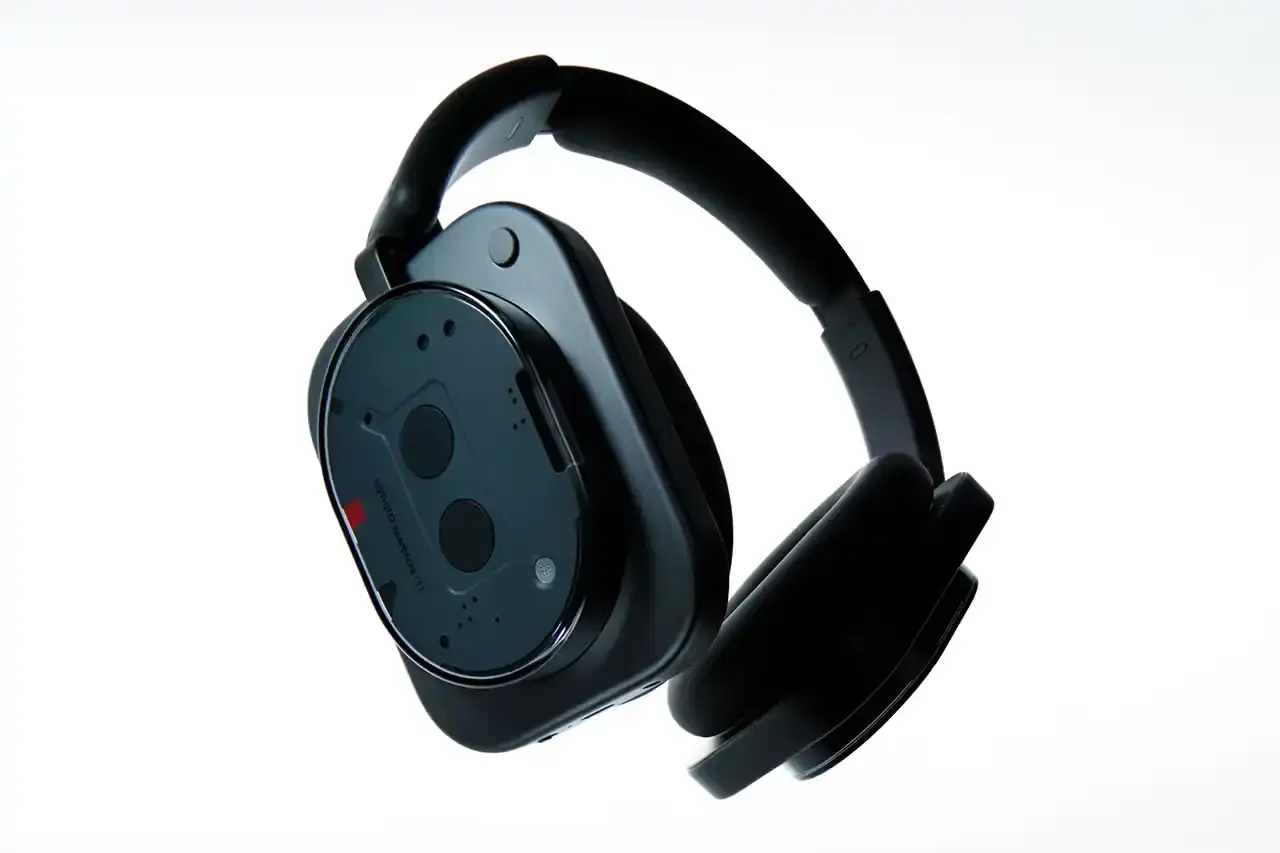 NOTHING LAUNCHES PHONE (3) AND HEADPHONE (1) image about Nothing's release of two new products: the Phone (3) smartphone and Headphone (1) over-ear headphones. The Phone (3) features a 6.67-inch display, Snapdragon 8s Gen 4 processor, and new Glyph Matrix micro-LED system. Camera specifications include triple 50MP rear cameras and 4K video recording. The Headphone (1) is Nothing's first over-ear audio product, developed with KEF, featuring 40mm drivers, adaptive noise cancellation, and 80 hours battery life. Both products are available for pre-order July 4 and general sale July 15. The Phone (3) starts at £799 GBP in black or white with storage options of 12GB/256GB and 16GB/512GB. The Headphone (1) costs £299 GBP in black or silver finishes. (image 3 of 6)