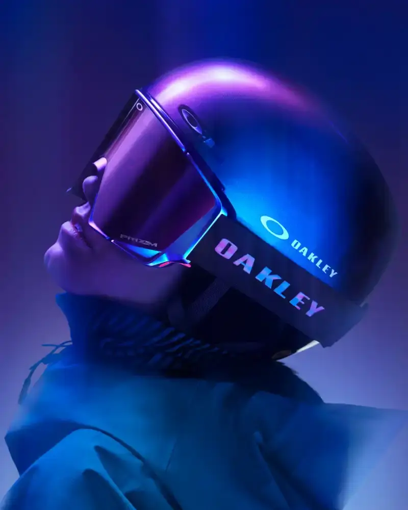 OAKLEY AURA COLLECTION USES COLOR-CHANGING PAINT Oakley introduces the Aura collection featuring eyewear, helmets, and accessories with color-changing paint in purple, green, red, and gold gradients. (image 3 of 6)