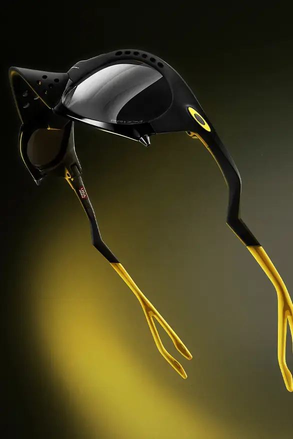 Oakley Oakley Plantaris sunglasses in black and yellow, with articulated arms and removable nose guards, showcasing a modern design inspired by frog anatomy, created in collaboration with Podpah podcast (image 2 of 4)