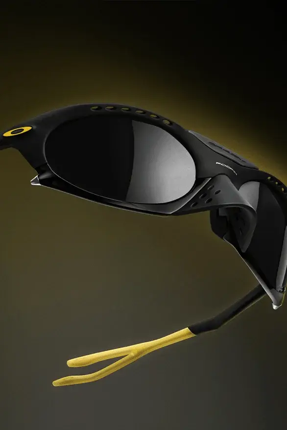Oakley Oakley Plantaris sunglasses in black and yellow, with articulated arms and removable nose guards, showcasing a modern design inspired by frog anatomy, created in collaboration with Podpah podcast (image 4 of 4)