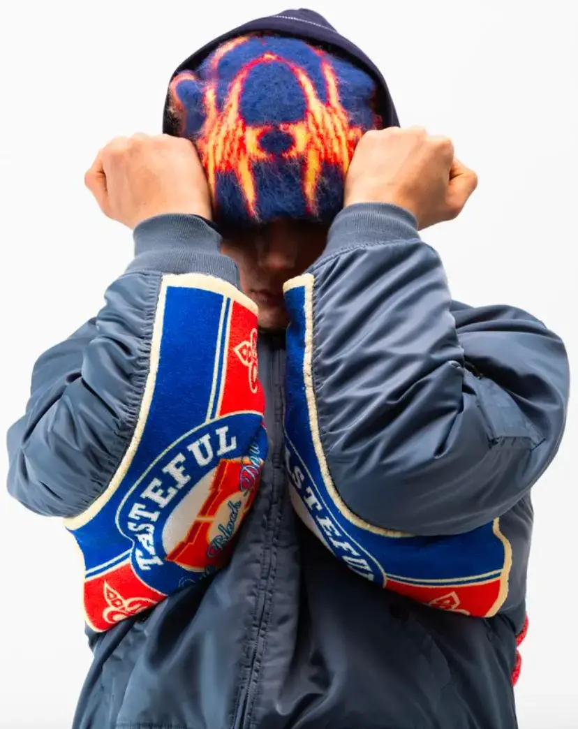 ONE BLOCK DOWN FW25 COLLECTION LAUNCHES IN MILAN Article about One Block Down's Fall/Winter 2025 collection, which combines medieval imagery, hockey aesthetics, and European winter sports culture in a streetwear context. (image 6 of 21)