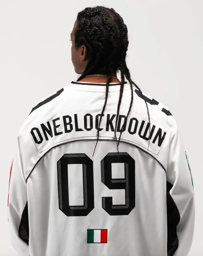 ONE BLOCK DOWN FW25 COLLECTION LAUNCHES IN MILAN Article about One Block Down's Fall/Winter 2025 collection, which combines medieval imagery, hockey aesthetics, and European winter sports culture in a streetwear context. (image 4 of 21)