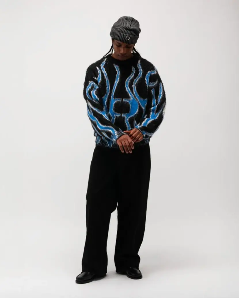 ONE BLOCK DOWN FW25 COLLECTION LAUNCHES IN MILAN Article about One Block Down's Fall/Winter 2025 collection, which combines medieval imagery, hockey aesthetics, and European winter sports culture in a streetwear context. (image 19 of 21)