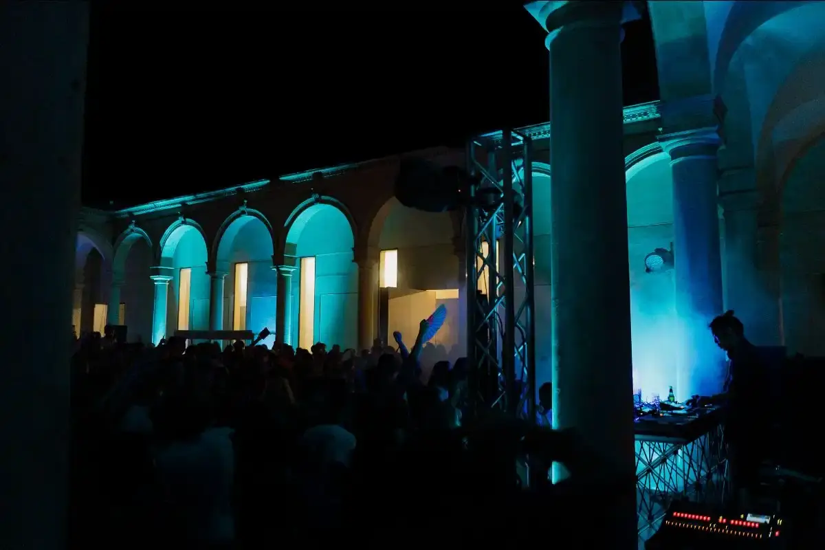 image about Ortigia Music Festival, a four-day electronic music event taking place on the island of Ortigia in Sicily from July 31 to August 3, 2025. The content describes the festival's venues including boat parties, beach stages, and late-night indoor spaces, along with performer lineup details and scheduling information. The article provides factual coverage of the event's programming, location context, and ticketing information for readers interested in electronic music festivals in the Mediterranean region. (image 2 of 3)