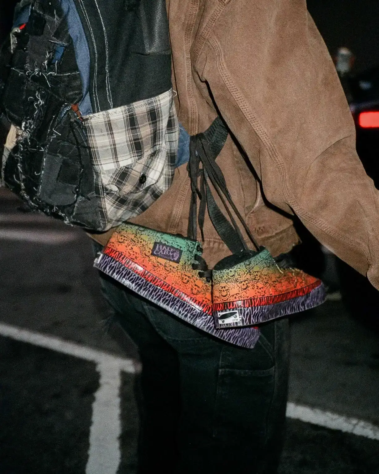 OTW BY VANS AND BAD IDEA BY CHITO LAUNCH THE HALF CAB 33 Wreckpack applies airbrush details to the Half Cab 33 while Liter adds geometric textile layers to a dark crewneck sweatshirt. (image 2 of 4)