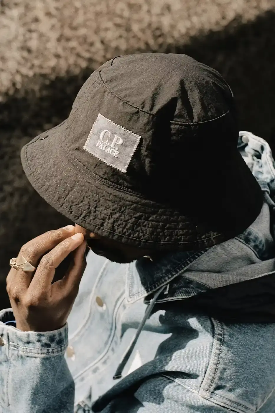 PALACE MEETS C.P. COMPANY: SKATE STYLE FUSES WITH ITALIAN CRAFT A fashion collaboration between Palace and C.P. Company. It details the "C.P. Palace" capsule collection featuring the Goggle Jacket, denim pieces, and various apparel in blue and khaki colors. The article provides information about the collection's availability starting March 28 at C.P. Company and Palace stores in multiple cities, plus a special pop-up at Dover Street Market Paris from March 28-30. (image 18 of 21)