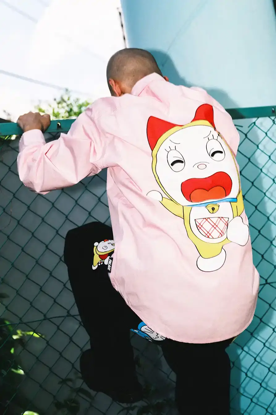 PALACE X DORAEMON COLLECTION DROPS FALL 2025 image of Palace streetwear brand collaborates with Japanese anime character Doraemon on clothing collection including jackets, shirts, and accessories. (image 4 of 11)
