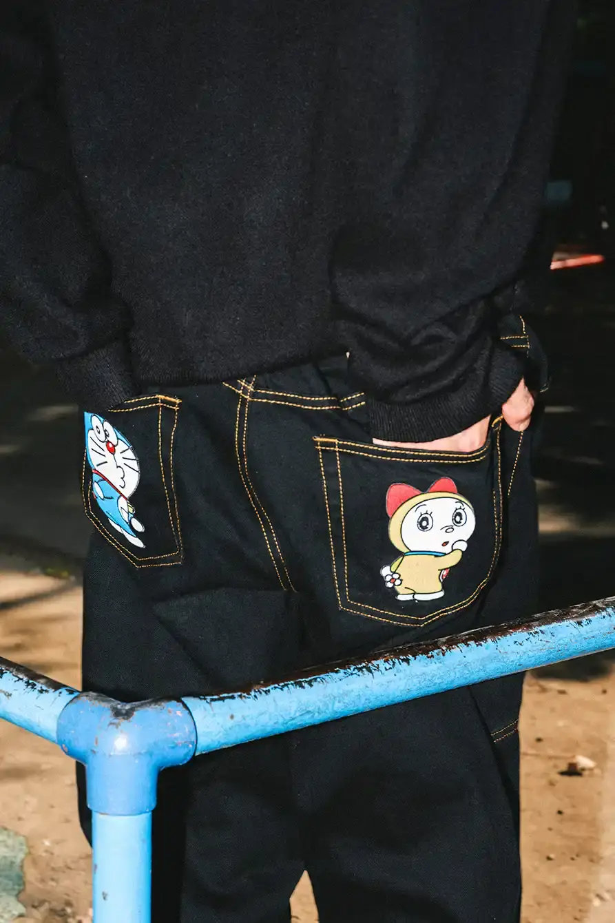 PALACE X DORAEMON COLLECTION DROPS FALL 2025 image of Palace streetwear brand collaborates with Japanese anime character Doraemon on clothing collection including jackets, shirts, and accessories. (image 6 of 11)
