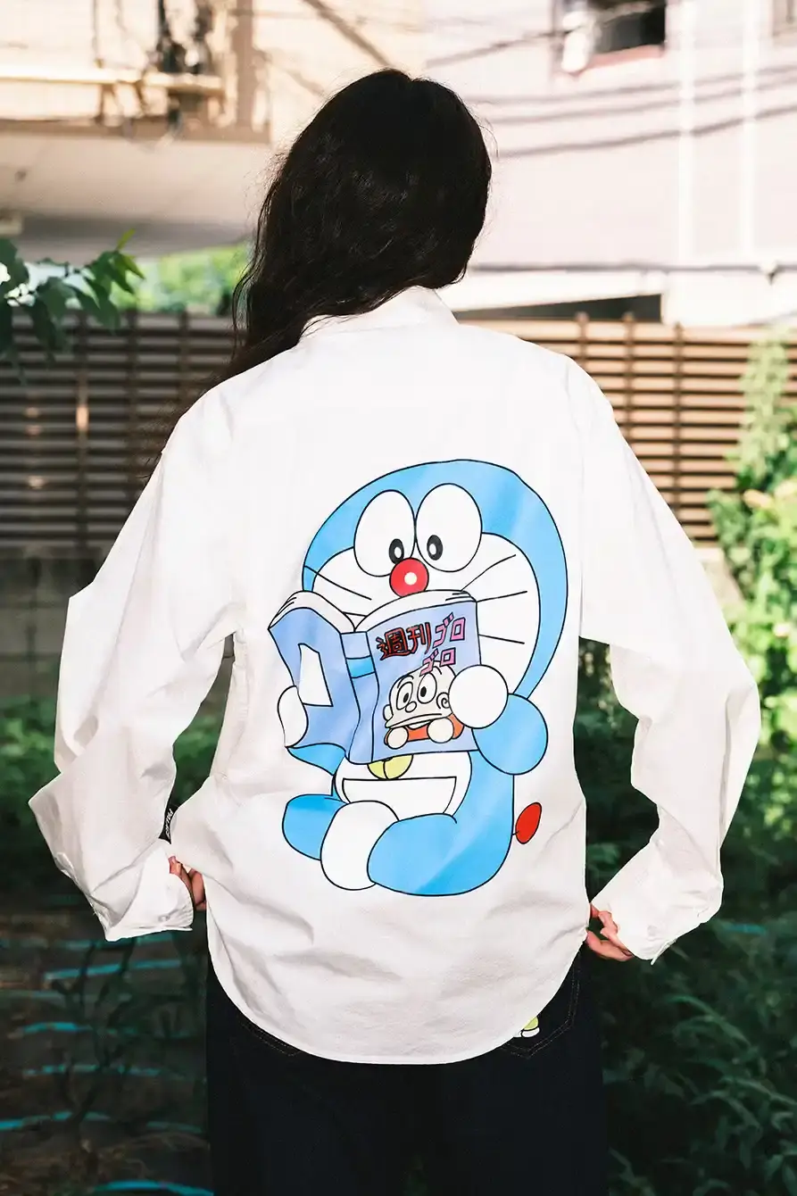 PALACE X DORAEMON COLLECTION DROPS FALL 2025 image of Palace streetwear brand collaborates with Japanese anime character Doraemon on clothing collection including jackets, shirts, and accessories. (image 9 of 11)