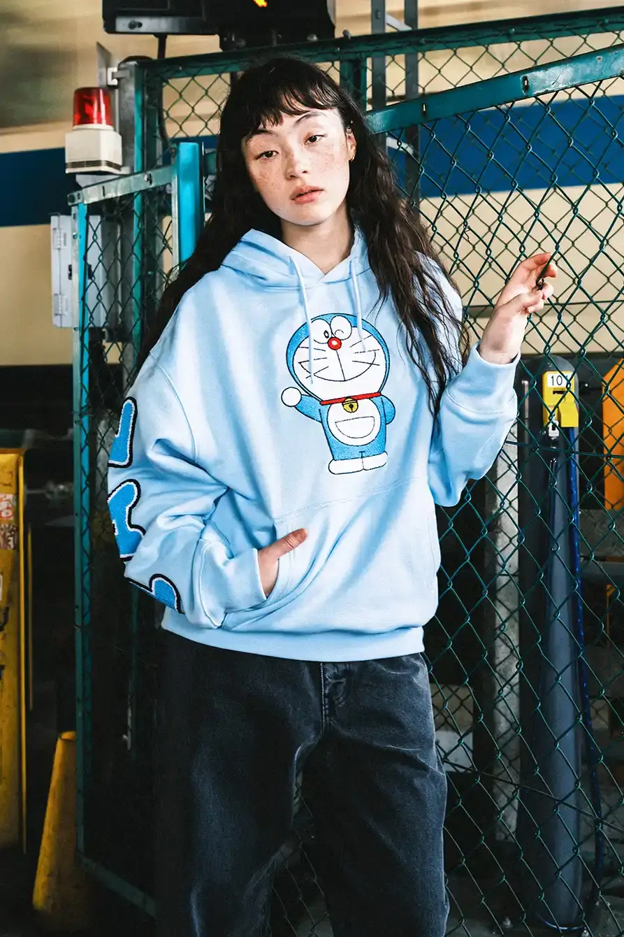 PALACE X DORAEMON COLLECTION DROPS FALL 2025 image of Palace streetwear brand collaborates with Japanese anime character Doraemon on clothing collection including jackets, shirts, and accessories. (image 8 of 11)