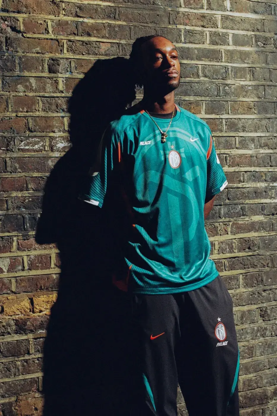 PALACE AND NIKE DELIVER MANOR PLACE FC FOOTBALL RANGE A look at the Palace and Nike Manor Place FC sportswear capsule, celebrating South London football culture through tracksuits, jerseys, and club apparel. (image 6 of 7)