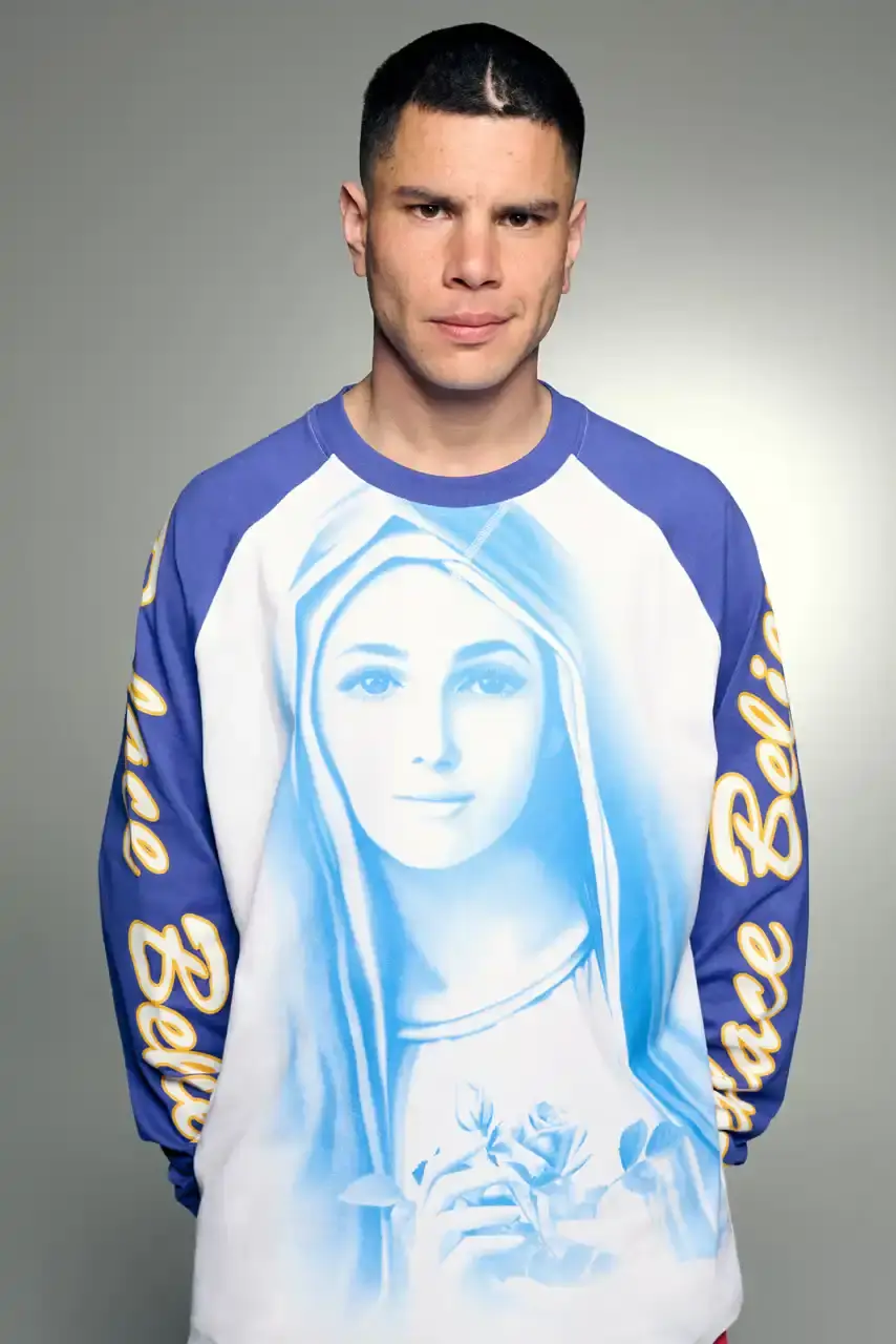 PALACE SUMMER 2025 COLLECTION: LONDON LABEL REVEALS SEASONAL LINEUP image of Palace's Summer 2025 collection announcement, describing the London streetwear brand's new seasonal offerings. It details the collection's design influences (Americana, sportswear, military), highlights key pieces including Los Angeles-themed items, religious iconography adaptations, and mesh garments for warm weather. The text also provides specific release dates and times for different global regions including the UK, Europe, US, Japan, Seoul, and China, with information about both online and physical store availability. (image 14 of 36)