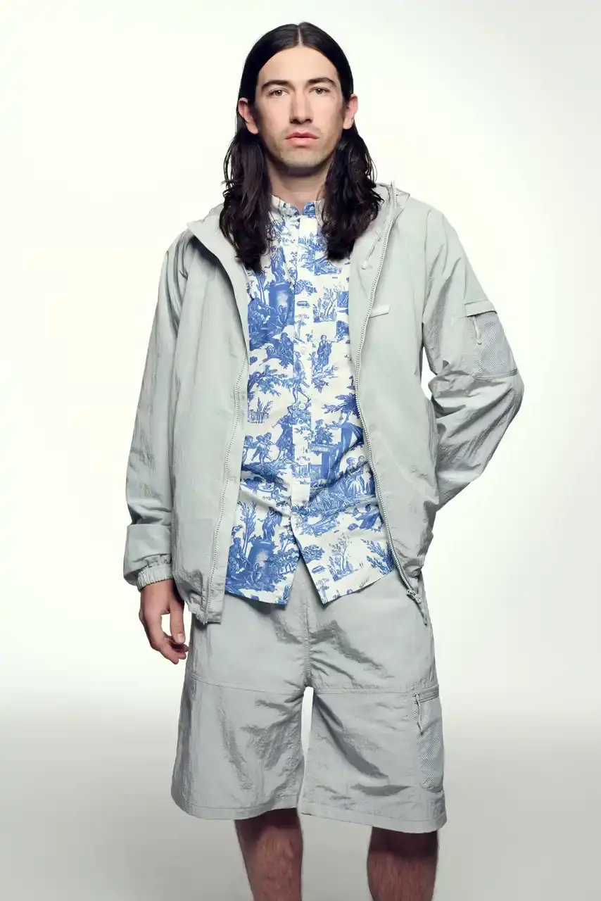 PALACE SUMMER 2025 COLLECTION: LONDON LABEL REVEALS SEASONAL LINEUP image of Palace's Summer 2025 collection announcement, describing the London streetwear brand's new seasonal offerings. It details the collection's design influences (Americana, sportswear, military), highlights key pieces including Los Angeles-themed items, religious iconography adaptations, and mesh garments for warm weather. The text also provides specific release dates and times for different global regions including the UK, Europe, US, Japan, Seoul, and China, with information about both online and physical store availability. (image 7 of 36)