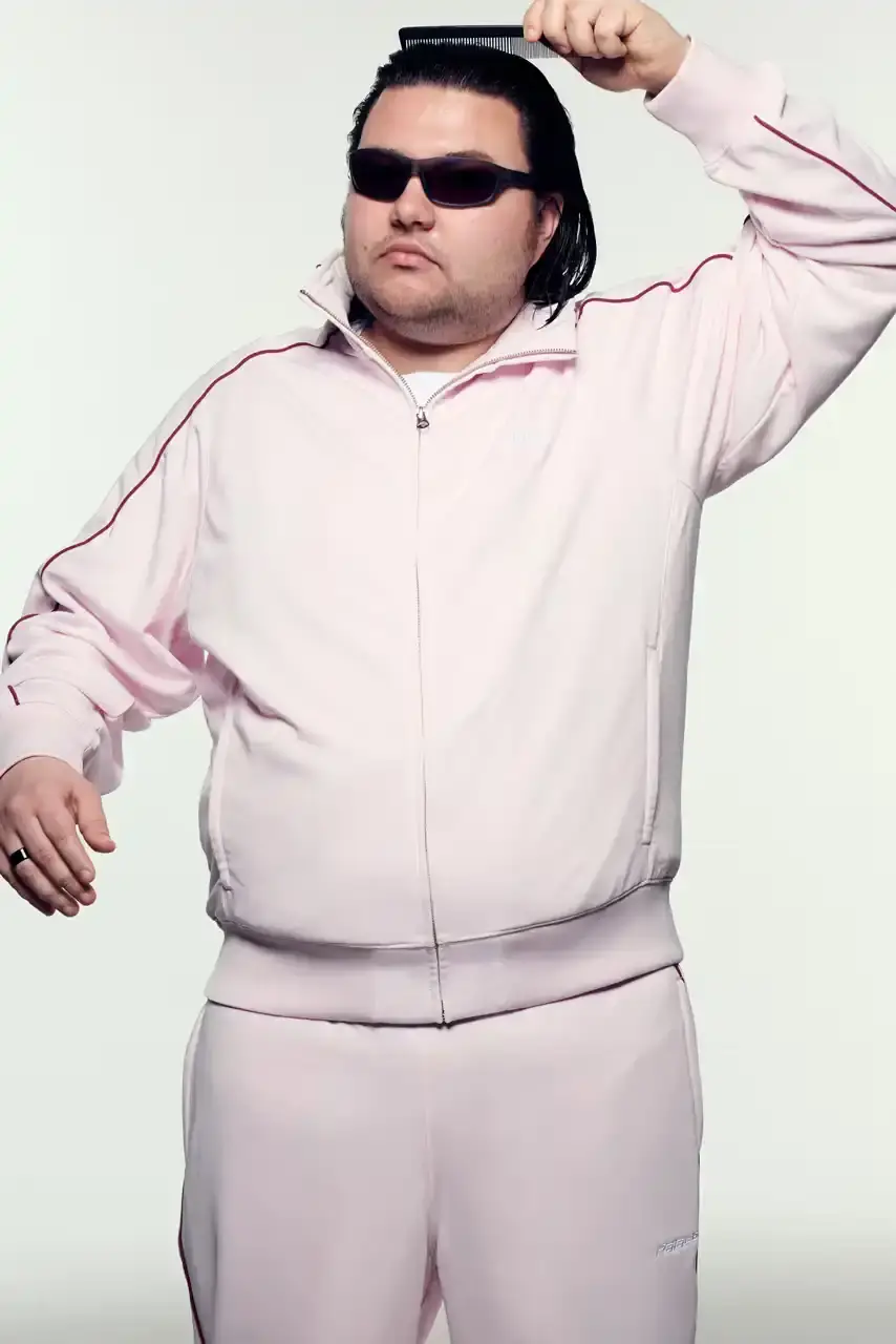 PALACE SUMMER 2025 COLLECTION: LONDON LABEL REVEALS SEASONAL LINEUP image of Palace's Summer 2025 collection announcement, describing the London streetwear brand's new seasonal offerings. It details the collection's design influences (Americana, sportswear, military), highlights key pieces including Los Angeles-themed items, religious iconography adaptations, and mesh garments for warm weather. The text also provides specific release dates and times for different global regions including the UK, Europe, US, Japan, Seoul, and China, with information about both online and physical store availability. (image 15 of 36)