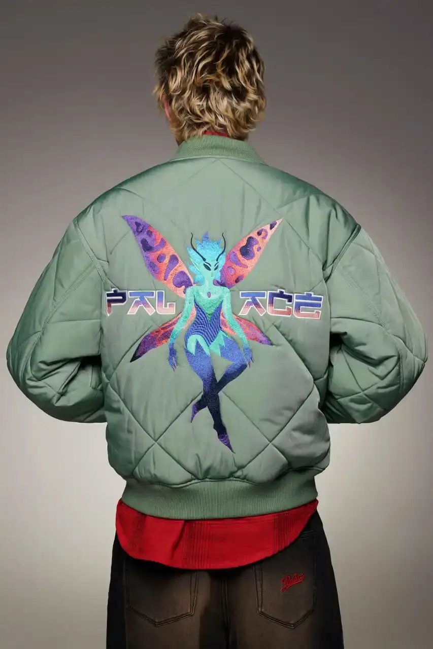 Palace Skateboards/Theo Sion Palace Spring 2025 lookbook showcasing a diverse collection of streetwear. Various models wear pieces including a tiger-embroidered varsity jacket, GORE-TEX outerwear, camouflage patterns, and racing-inspired jerseys. The collection features a mix of athletic and casual styles in multiple colorways, with detailed shots of snake graphics and workwear pieces
