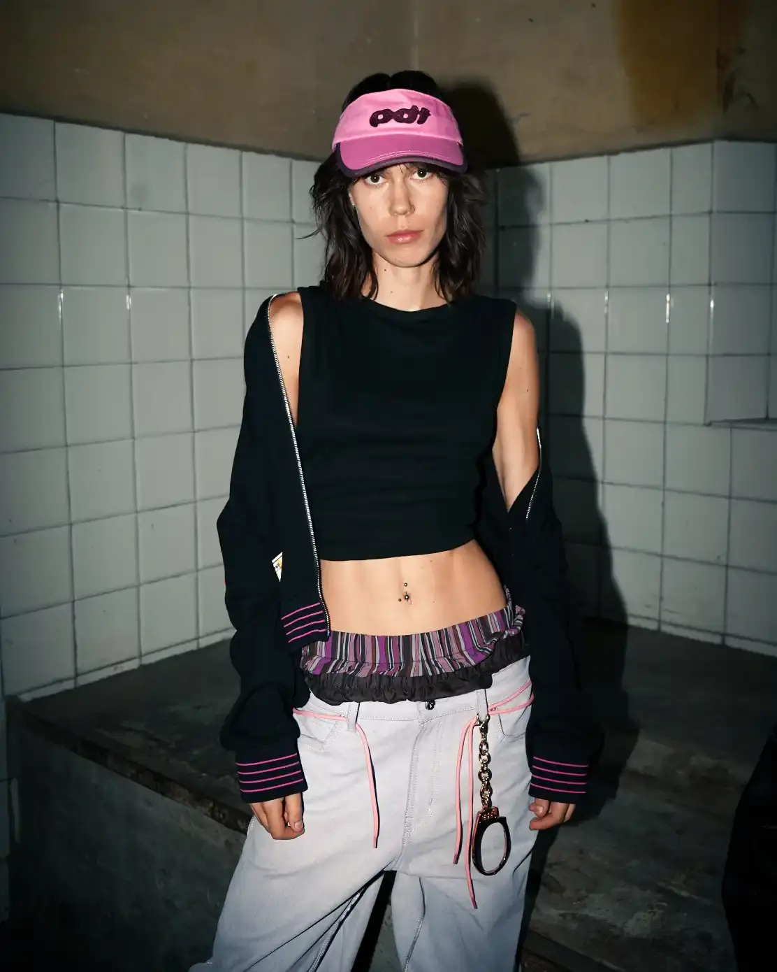 PDF'S PRISON-THEMED SHOW AT MILAN FASHION WEEK image about Pdf brand's theatrical runway presentation at Milan Fashion Week, featuring celebrity models in a recreated prison setting to showcase streetwear designs with themes of creative freedom and constraint. shoot by Costanza Terranova (image 7 of 20)