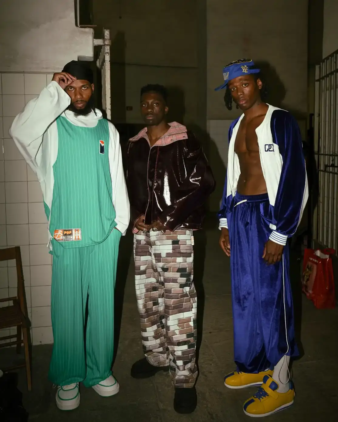 PDF'S PRISON-THEMED SHOW AT MILAN FASHION WEEK image about Pdf brand's theatrical runway presentation at Milan Fashion Week, featuring celebrity models in a recreated prison setting to showcase streetwear designs with themes of creative freedom and constraint. shoot by Costanza Terranova (image 16 of 20)