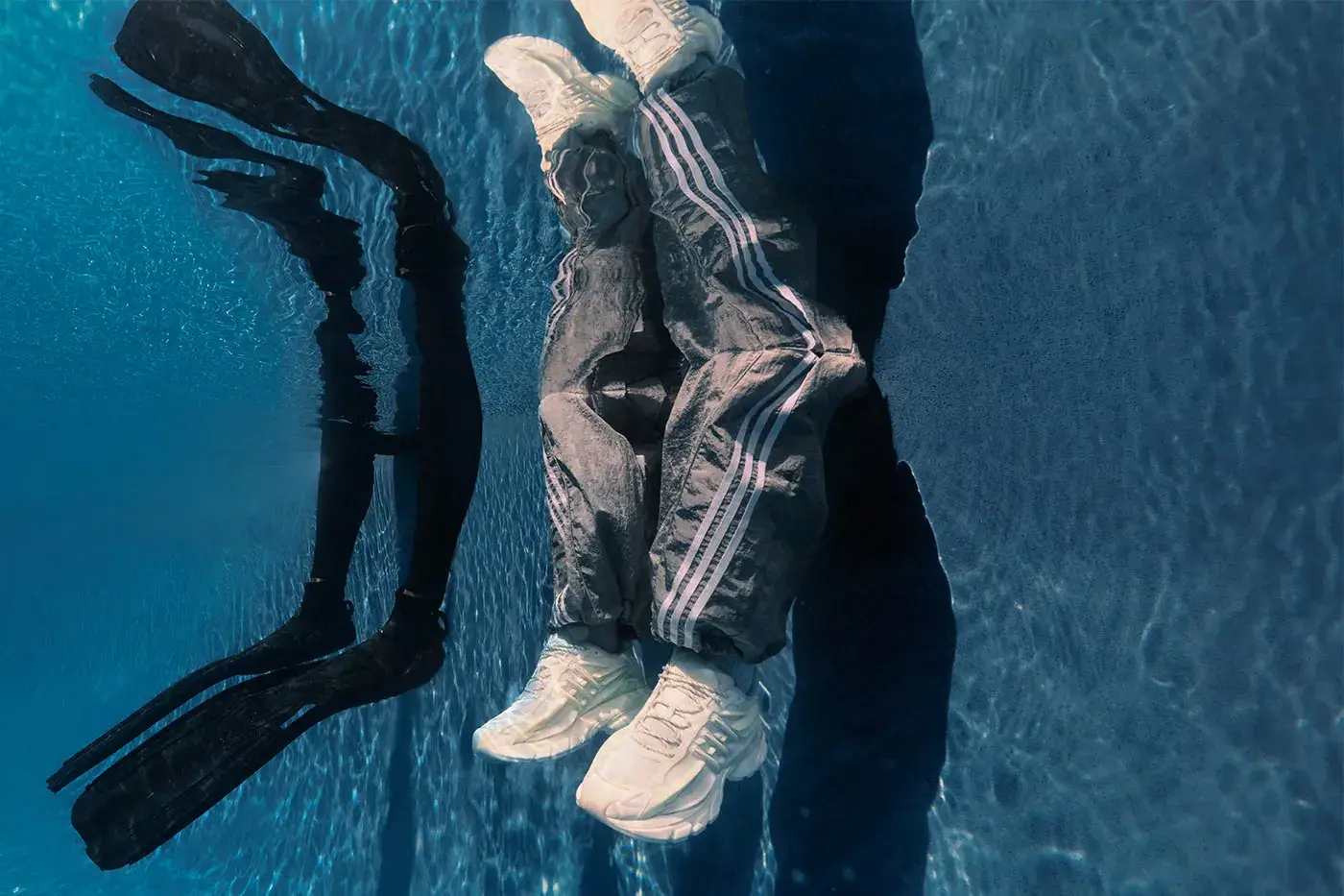 PHARRELL ADIDAS VIRGINIA ADISTAR JELLYFISH Plain white background showing the all-white adidas VIRGINIA Adistar Jellyfish sneaker with a caged upper and thick wavy sole. (image 4 of 4)