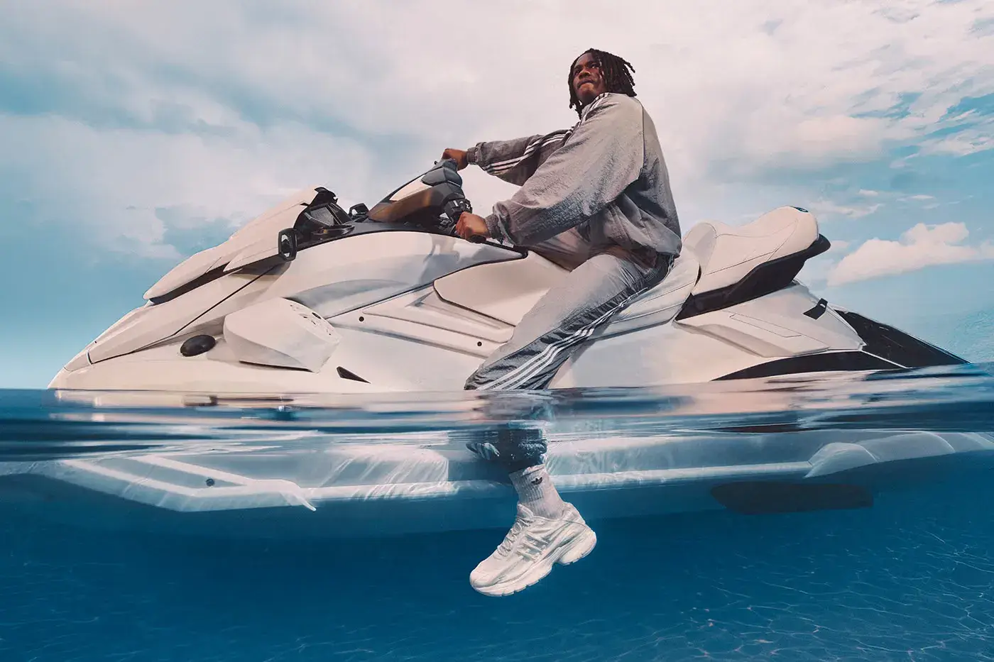 PHARRELL ADIDAS VIRGINIA ADISTAR JELLYFISH Plain white background showing the all-white adidas VIRGINIA Adistar Jellyfish sneaker with a caged upper and thick wavy sole. (image 3 of 4)