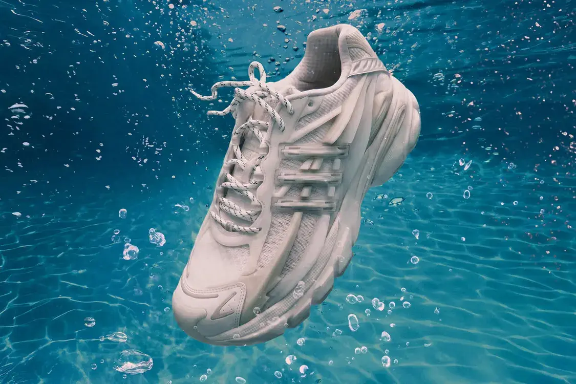 PHARRELL ADIDAS VIRGINIA ADISTAR JELLYFISH Plain white background showing the all-white adidas VIRGINIA Adistar Jellyfish sneaker with a caged upper and thick wavy sole.