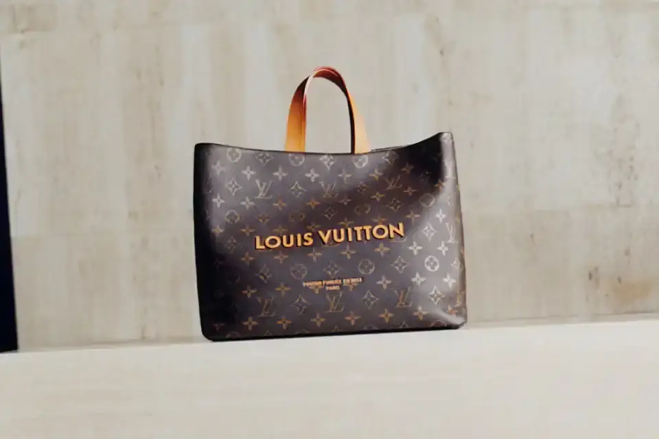 Stef Mitchell Models wearing Louis Vuitton Spring 2025 collection pose in UNESCO's headquarters. They're dressed in earth-toned suits and casual wear, photographed in formal meeting rooms and gardens. The images showcase bags, sunglasses, and diplomatic-inspired fashion against modernist architecture. (image 6 of 15)
