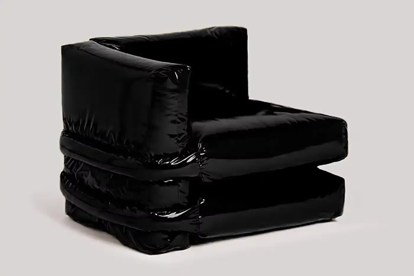 KASSL EDITIONS PILLOW SOFA GETS GLOSSY BLACK UPDATE image about furniture designers Muller Van Severen relaunching their Pillow Sofa design in a new glossy black fabric option. (image 3 of 5)