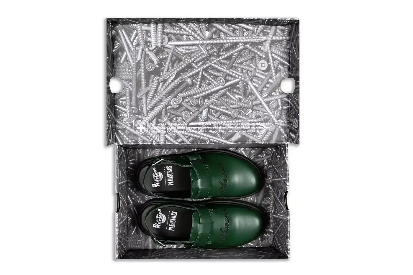 Ian Dooley/Pleasures Green leather Dr. Martens Jorge Mule featuring black metal buckles, cursive PLEASURES branding stitched on the upper, signature yellow stitching, and a black Vibram outsole. The collaboration merges both brands' distinctive styles in a versatile slip-on design. (image 9 of 11)