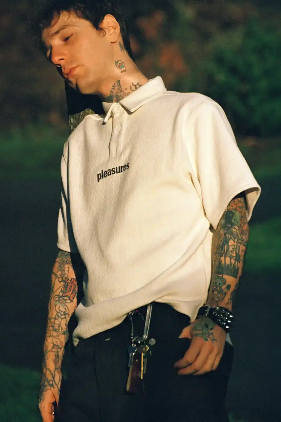 PLEASURES STRANGE WAYS EVERYDAY SPRING 2026 An article detailing the PLEASURES Spring 2026 clothing collection featuring workwear, denim, and graphic shirts shot by Jason Landis in London. (image 10 of 40)