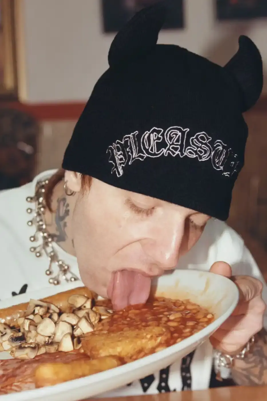 PLEASURES STRANGE WAYS EVERYDAY SPRING 2026 An article detailing the PLEASURES Spring 2026 clothing collection featuring workwear, denim, and graphic shirts shot by Jason Landis in London. (image 11 of 40)